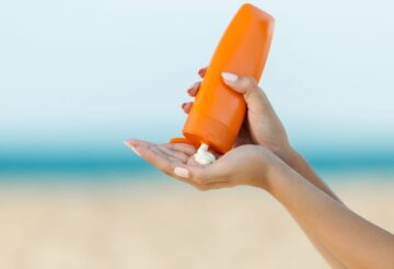 squeezing sunscreen